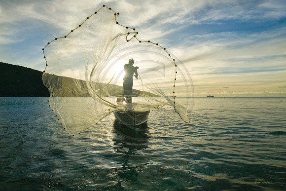Fisherman tossing net.  St Thomas, USVI